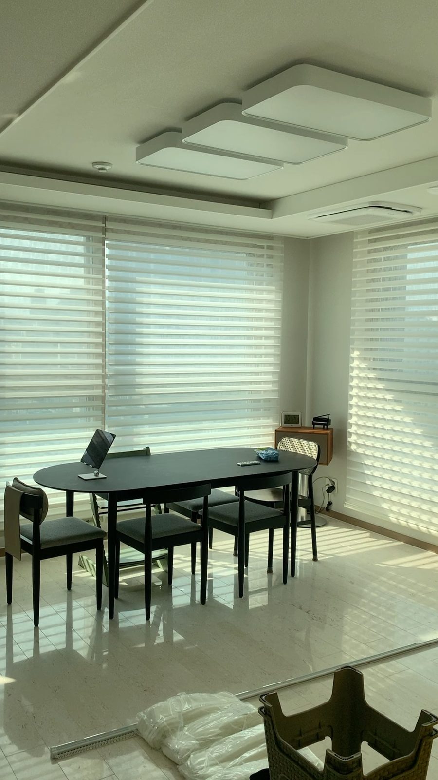 Triple shades installed in a dining area