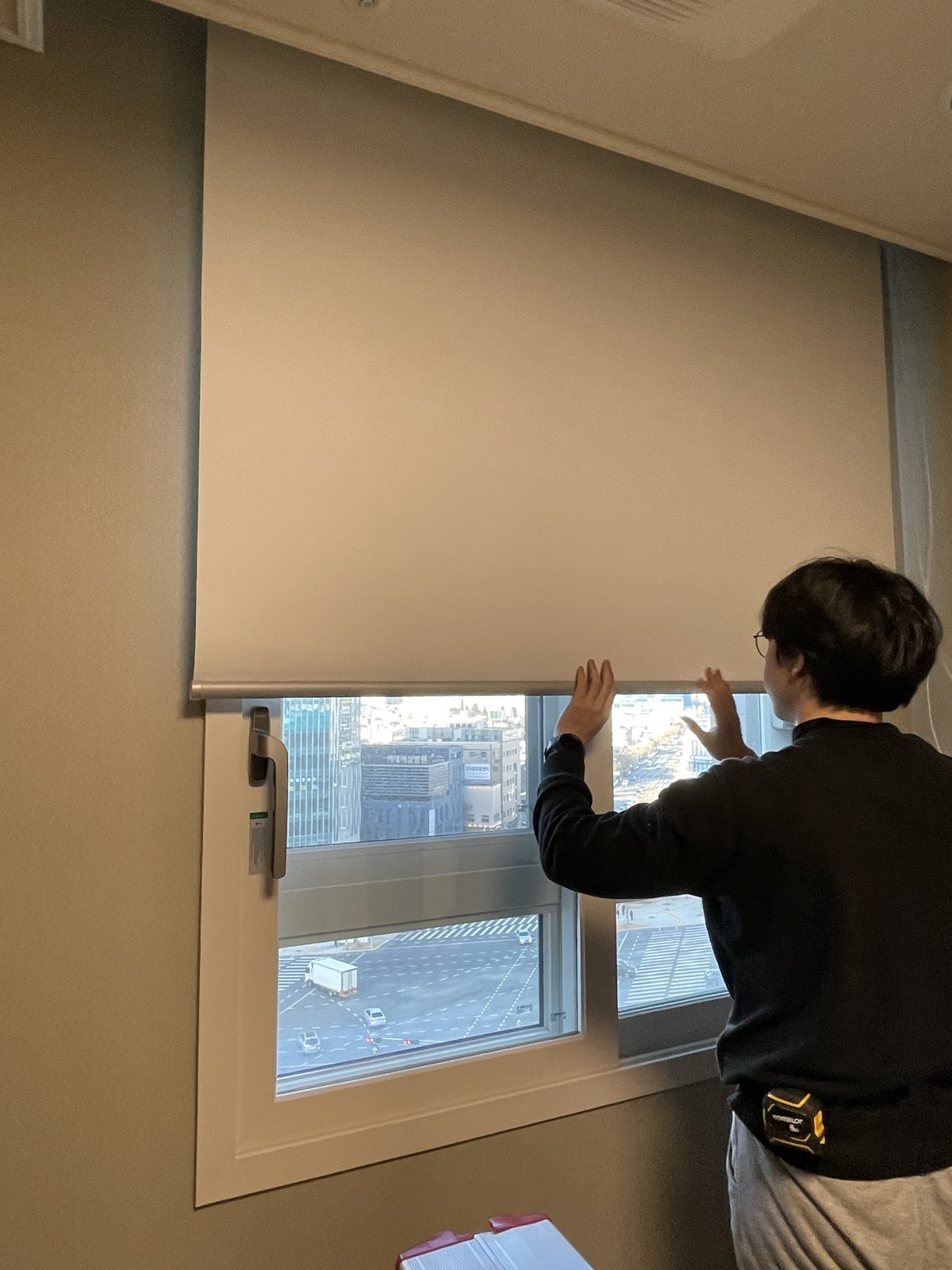 Our team installing a roller shade
